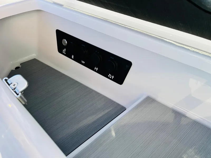 Slide: The Image of Control panel of 2025 Nautique Super Air Nautique G23 boat interior. - 23