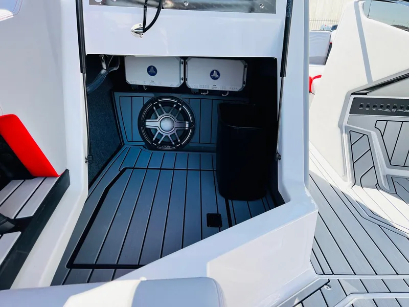 Slide: The Image of 2025 Nautique Super Air Nautique G23 interior with sleek flooring and modern design elements. - 26
