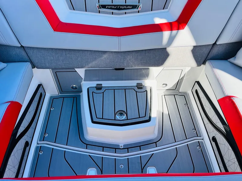Slide: The Image of 2025 Nautique Super Air Nautique G23 interior with red accents and sleek design. - 36