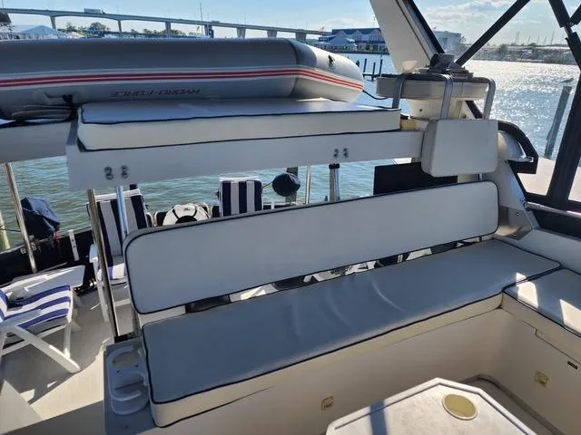 Slide: The Image of 1988 President 37 Sundeck boat interior with seating and water view. - 10