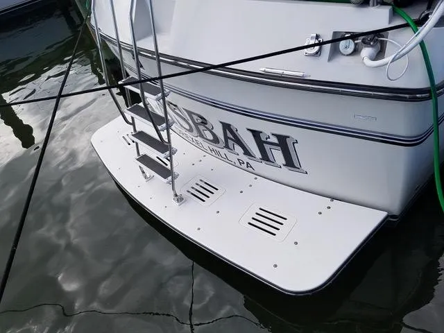 Slide: The Image of 1988 President 37 Sundeck yacht interior with striped cushions and a white table. - 17