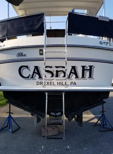 Slide: The Image of 1988 President 37 Sundeck yacht interior with helm, seating, and marina view. - 18