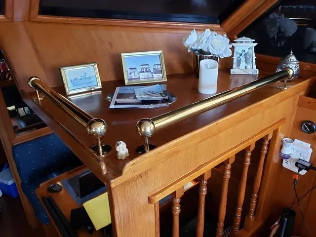 Slide: The Image of 1988 President 37 Sundeck yacht, partial side view with railing and windows. - 29