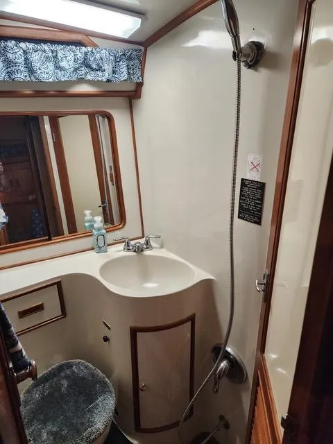 Slide: The Image of Interior of 1988 President 37 Sundeck yacht with cozy seating and TV. - 34