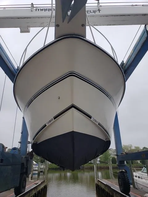 Slide: The Image of 1988 President 37 Sundeck yacht bathroom with sink, mirror, and shower. - 45