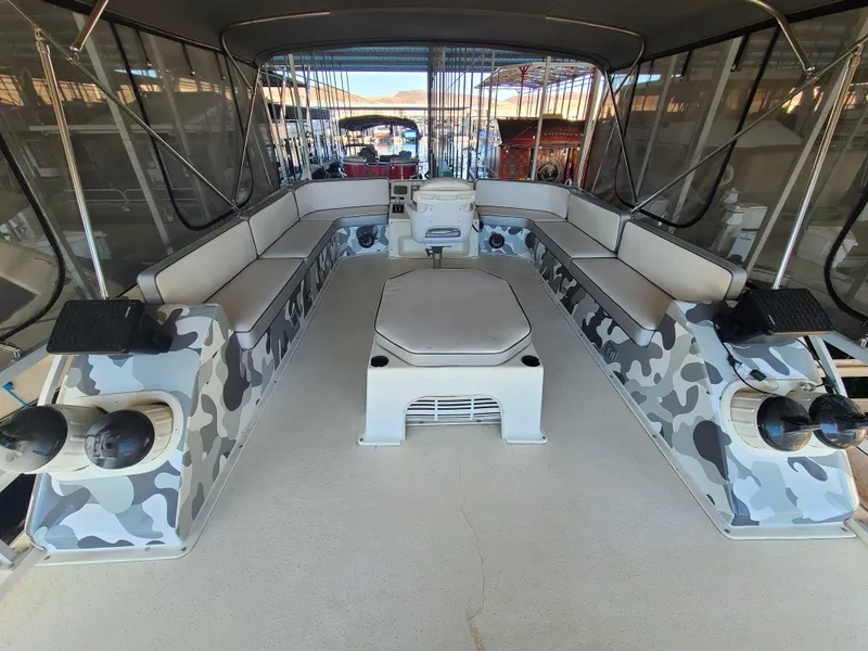 Slide: The Image of Spacious 1993 Gibson SPORT SERIES boat interior with camo accents and ample seating. - 23