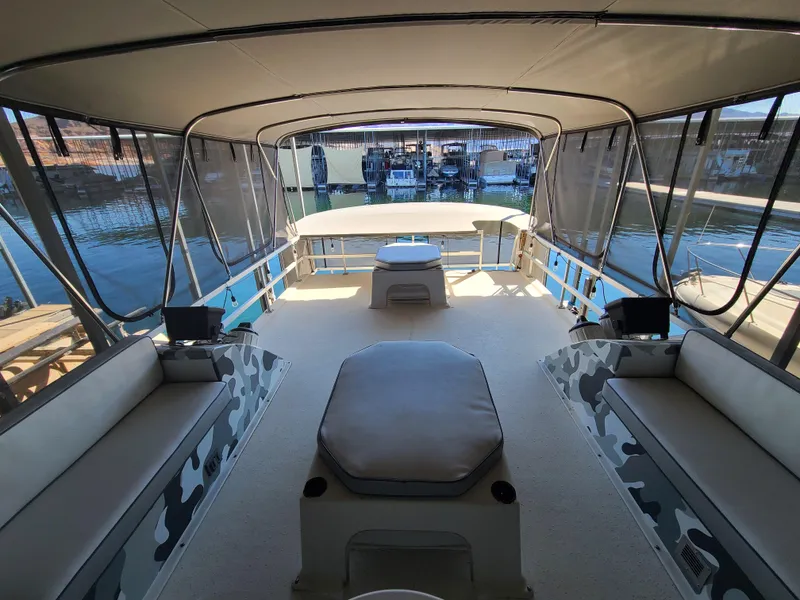 Slide: The Image of Interior view of a 1993 Gibson SPORT SERIES boat with seating and canopy. - 24