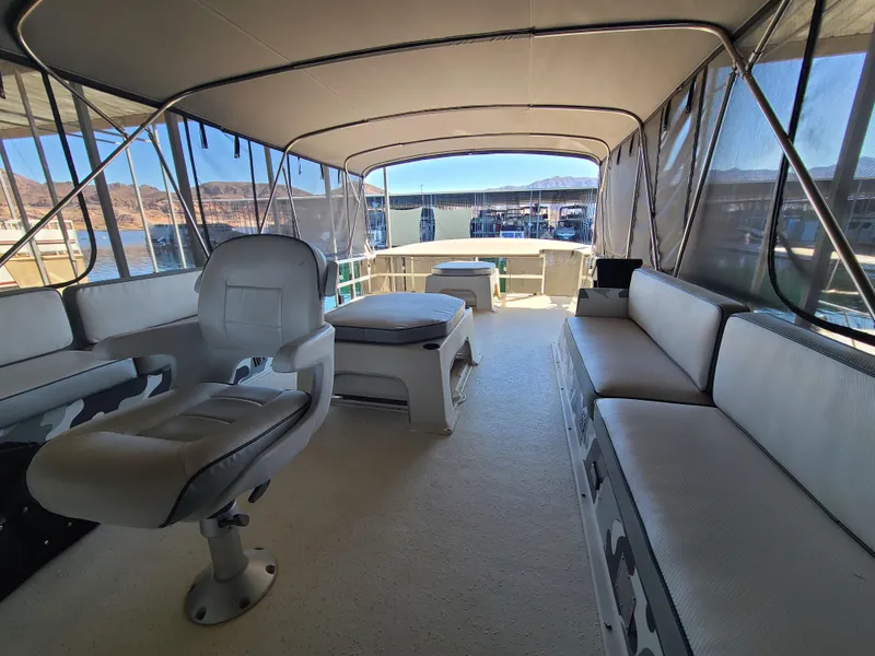 Slide: The Image of Interior of a 1993 Gibson SPORT SERIES boat with seating and helm. - 25