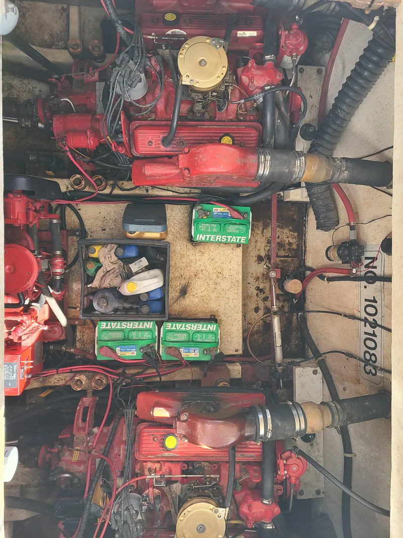 Slide: The Image of 1993 Gibson SPORT SERIES engine compartment with dual red engines and Interstate batteries. - 27