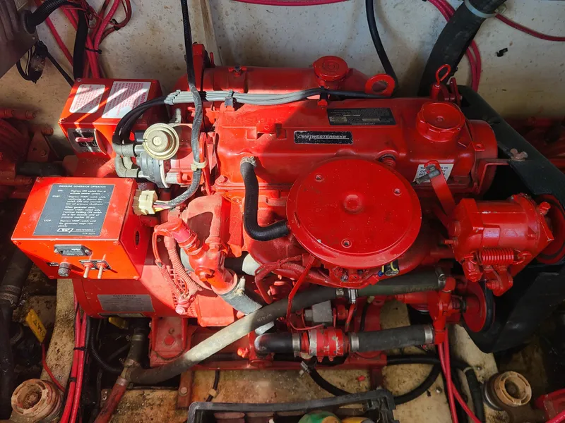 Slide: The Image of Red engine of a 1993 Gibson SPORT SERIES, showcasing intricate mechanical components. - 28