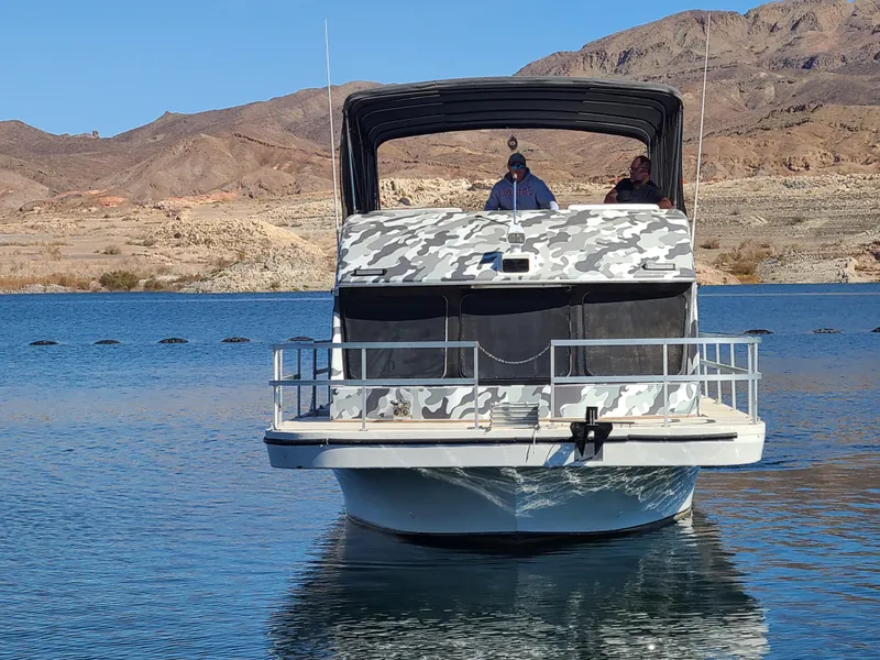 Slide: The Image of Gibson SPORT SERIES 1993 boat on a lake with desert mountains in the background. - 4