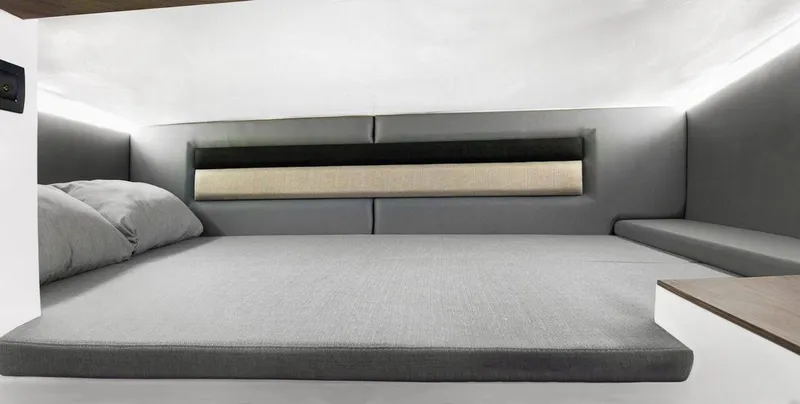 Slide: The Image of 2025 Ranieri 275 LS interior cabin with modern bedding and sleek design. - 10