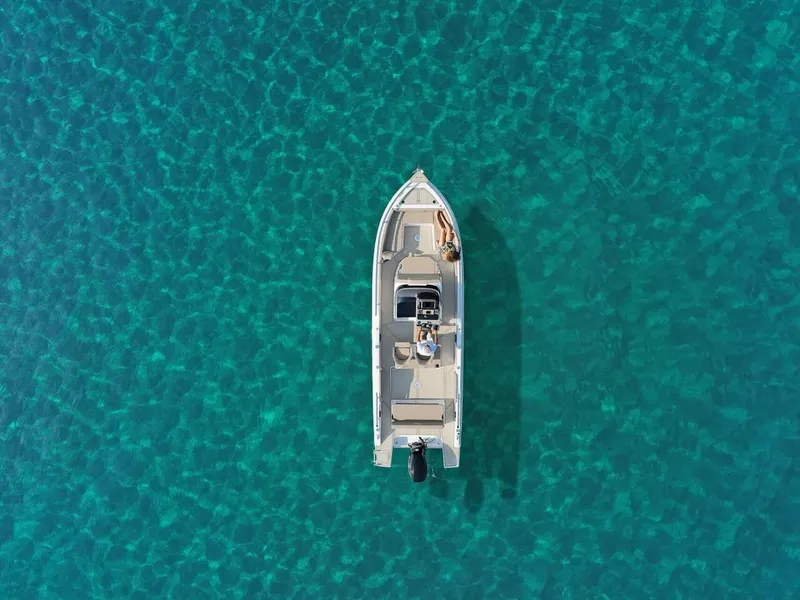 Slide: The Image of Aerial view of 2025 Ranieri 275 LS boat on clear turquoise water. - 7