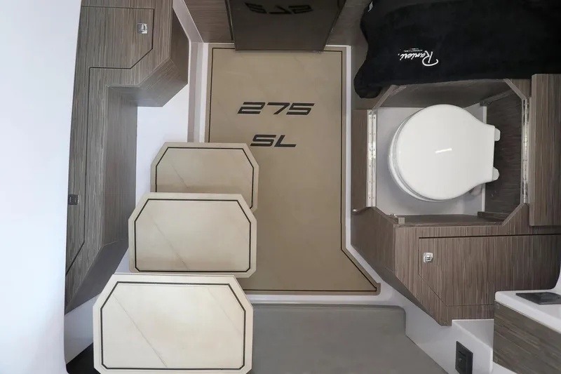 Slide: The Image of Interior of 2025 Ranieri 275 LS boat, featuring modern design and compact layout. - 8