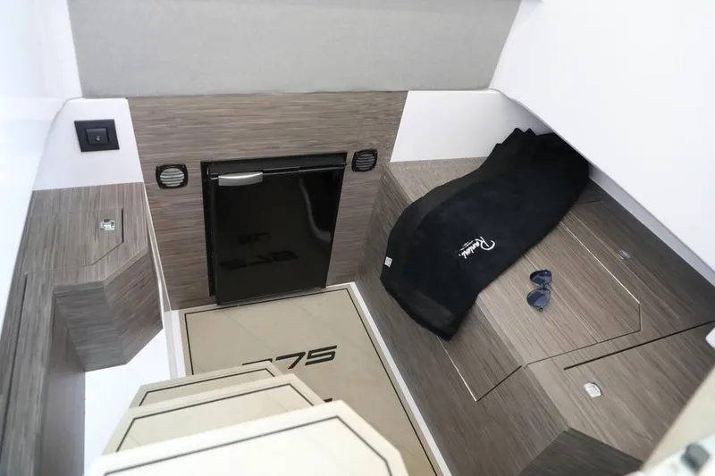 Slide: The Image of Interior of 2025 Ranieri 275 LS boat with modern design and compact amenities. - 9