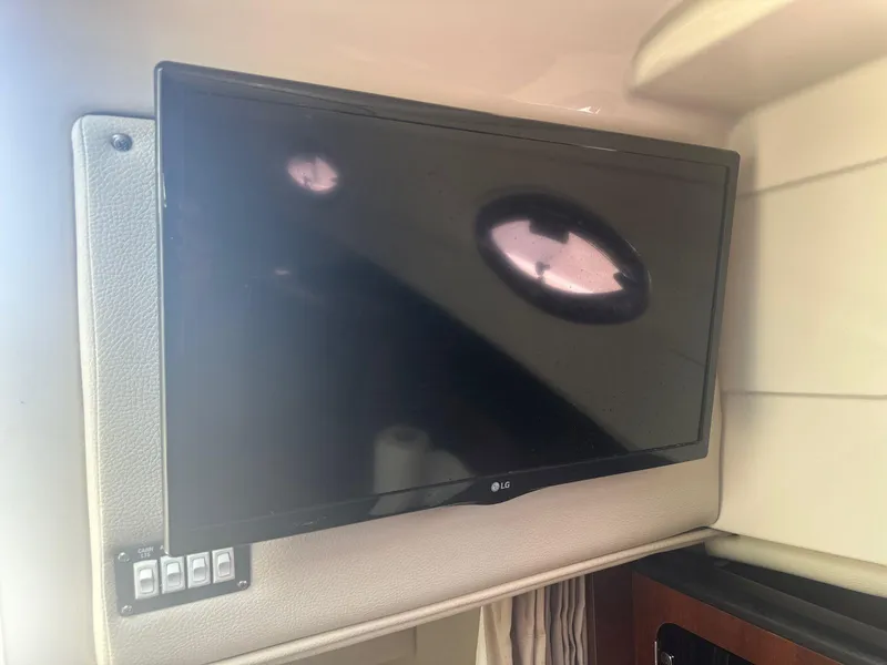Slide: The Image of LG TV inside 2018 Robalo R305 Walkaround boat cabin. - 15
