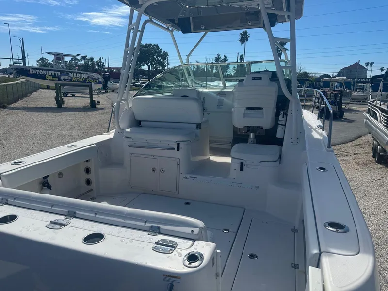 Slide: The Image of 2018 Robalo R305 Walkaround boat with spacious cockpit and seating area. - 5