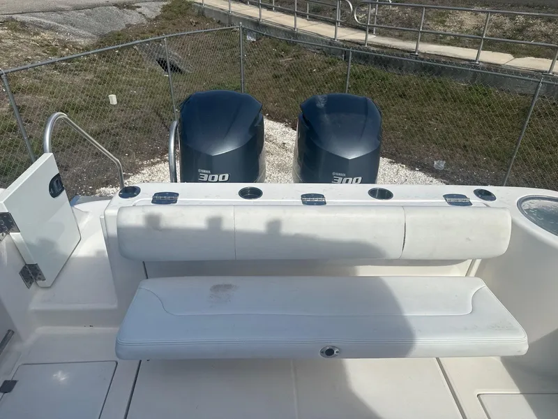 Slide: The Image of 2018 Robalo R305 Walkaround boat with twin 300 horsepower engines and seating area. - 6
