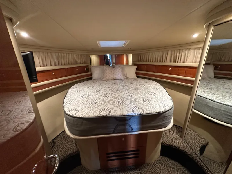 Slide: The Image of Luxurious bedroom interior of 2001 Sea Ray 480 Sedan Bridge yacht. - 17