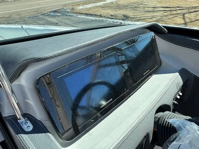 Slide: The Image of 2025 Regal LS4 Surf boat dashboard with modern touchscreen display. - 11
