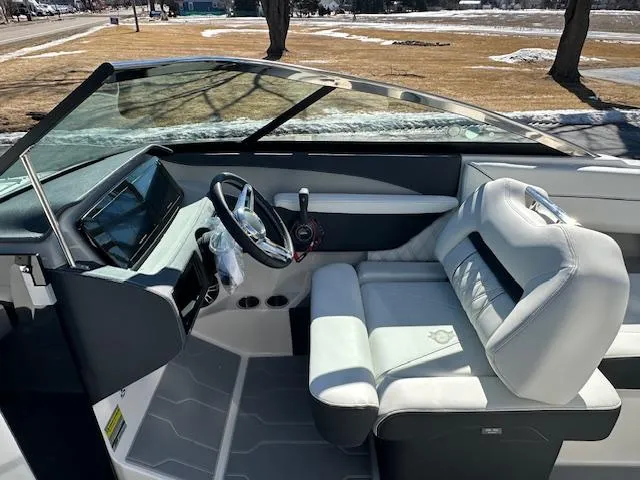 Slide: The Image of 2025 Regal LS4 Surf boat interior with modern dashboard and comfortable seating. - 12