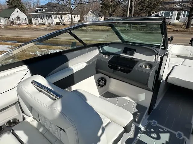 Slide: The Image of 2025 Regal LS4 Surf boat interior with modern seating and dashboard design. - 13