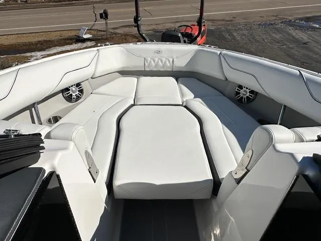 Slide: The Image of 2025 Regal LS4 Surf boat interior with white seating and speakers. - 20