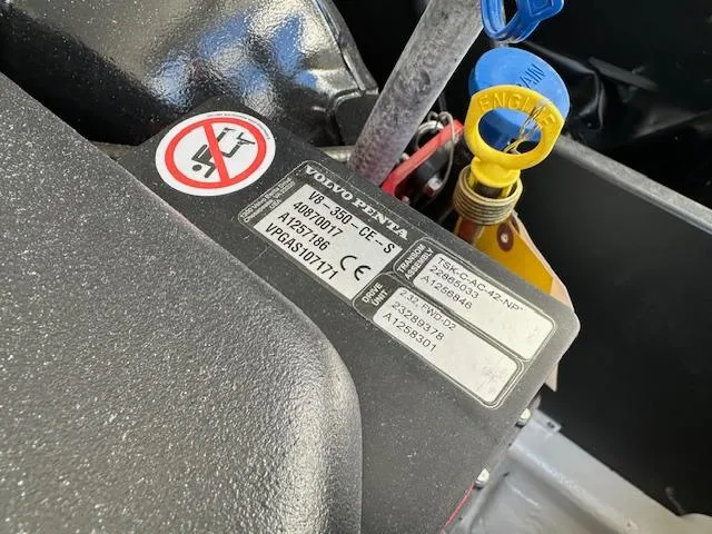 Slide: The Image of Close-up of a 2025 Regal LS4 Surf engine with Volvo Penta label and dipstick. - 24