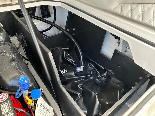 Slide: The Image of Engine compartment of 2025 Regal LS4 Surf boat, showcasing internal components and wiring. - 25