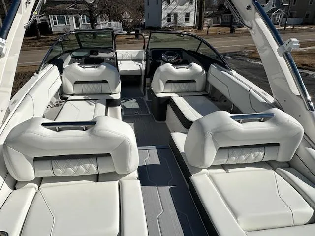 Slide: The Image of 2025 Regal LS4 Surf boat interior with luxurious white seating and modern design. - 5