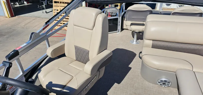 Slide: The Image of 2023 Sun Tracker SF-22XP3 boat interior with beige seating and modern design. - 10