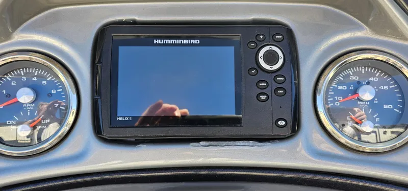 Slide: The Image of Dashboard of 2023 Sun Tracker SF-22XP3 with Humminbird Helix 5 and gauges. - 14