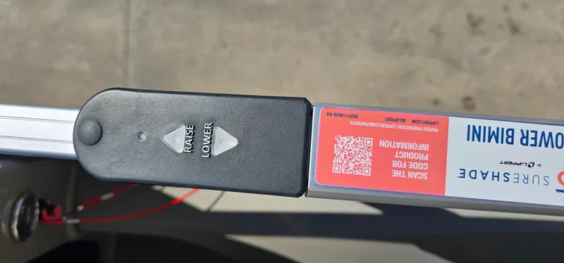 Slide: The Image of 2023 Sun Tracker SF-22XP3 power bimini control with raise and lower buttons. - 18