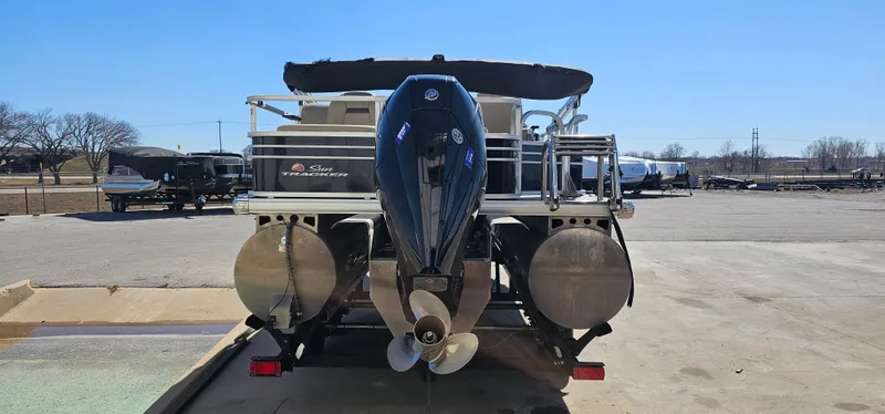 Slide: The Image of 2023 Sun Tracker SF-22XP3 pontoon boat with outboard motor, rear view. - 2