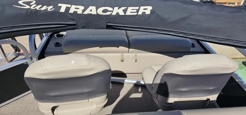 Slide: The Image of 2023 Sun Tracker SF-22XP3 boat interior with seating and canopy. - 21