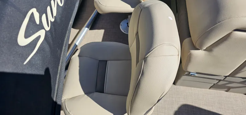 Slide: The Image of 2023 Sun Tracker SF-22XP3 boat seats, beige upholstery, partial logo visible. - 22