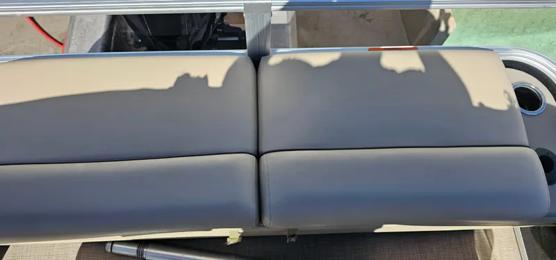 Slide: The Image of 2023 Sun Tracker SF-22XP3 boat seat with beige upholstery and cup holders. - 23