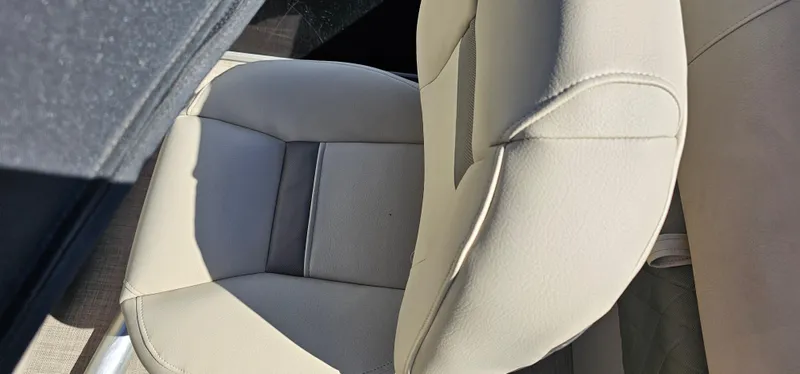 Slide: The Image of 2023 Sun Tracker SF-22XP3 boat seat, beige upholstery, top view. - 24