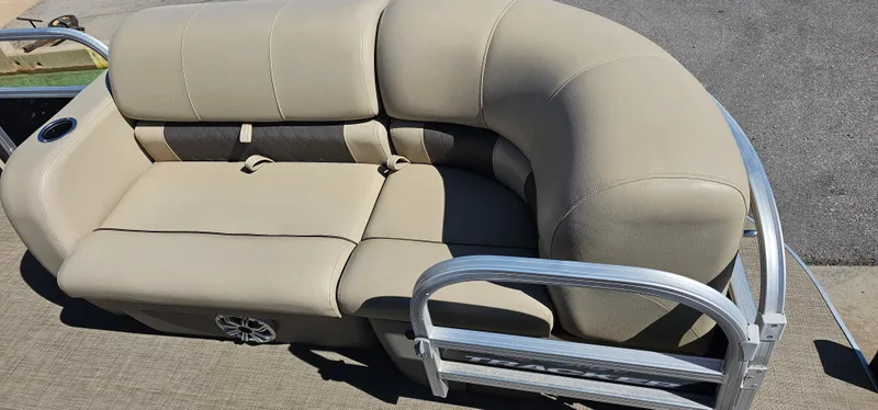 Slide: The Image of 2023 Sun Tracker SF-22XP3 pontoon boat seating with beige upholstery and metal railing. - 6