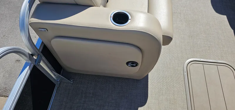 Slide: The Image of 2023 Sun Tracker SF-22XP3 boat interior with beige seating and cup holder. - 7