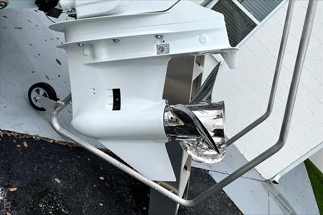 Slide: The Image of 2025 Aquasport 2200 Center Console boat propeller, shiny and metallic, on a trailer. - 10