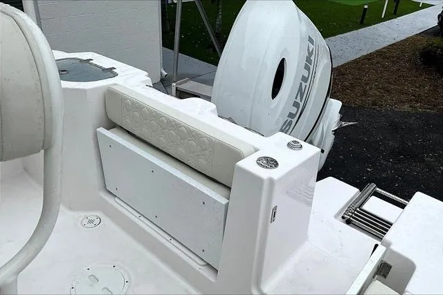 Slide: The Image of 2025 Aquasport 2200 Center Console boat with Suzuki outboard motor. - 14