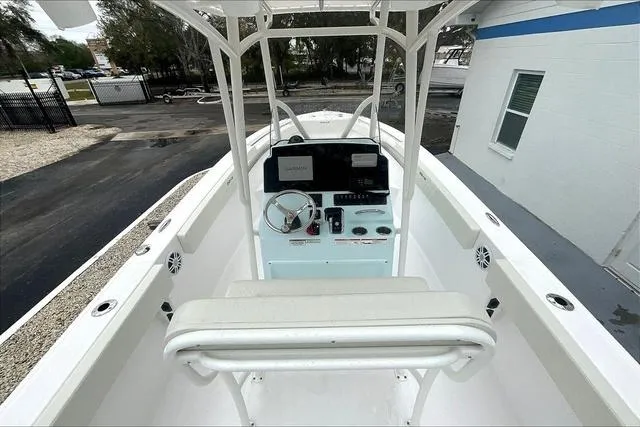 Slide: The Image of 2025 Aquasport 2200 Center Console boat with modern helm and seating. - 22