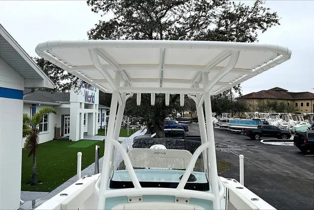 Slide: The Image of 2025 Aquasport 2200 Center Console boat with T-top in dealership lot. - 40