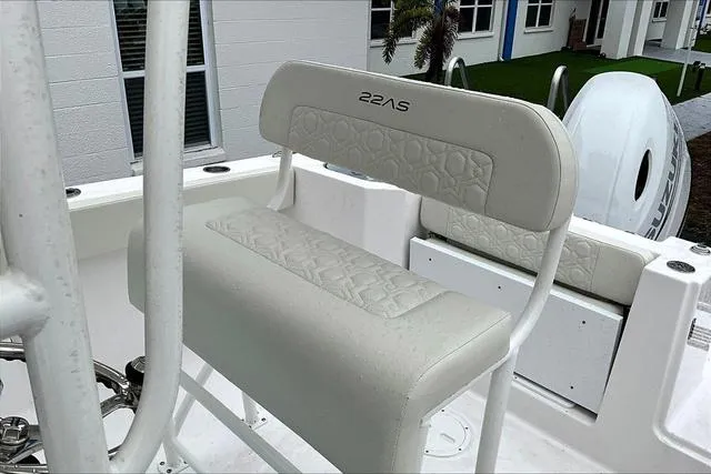 Slide: The Image of 2025 Aquasport 2200 Center Console boat seat with white upholstery and modern design. - 48
