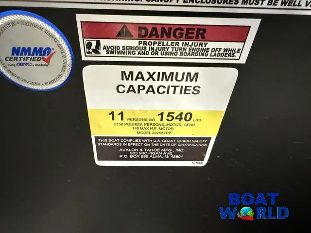 Slide: The Image of 2025 Tahoe Sport 23' Fish & Cruise capacity label, 11 persons or 1540 lbs, safety warning. - 16