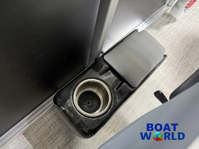 Slide: The Image of 2025 Tahoe Sport 23' Fish & Cruise boat interior with cup holder. - 17