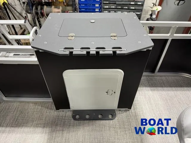 Slide: The Image of 2025 Tahoe Sport 23' Fish & Cruise boat interior with storage compartment. - 21