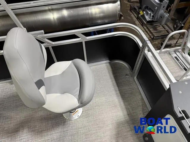 Slide: The Image of 2025 Tahoe Sport 23' Fish & Cruise boat interior with swivel seat and railing. - 22