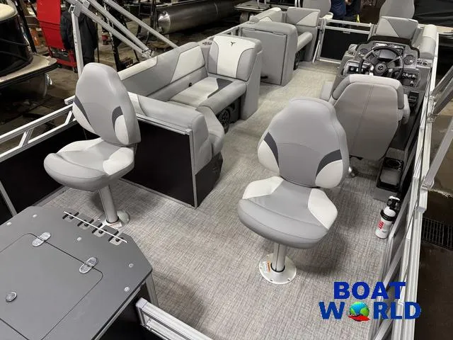 Slide: The Image of 2025 Tahoe Sport 23' Fish & Cruise boat interior with modern seating and controls. - 24